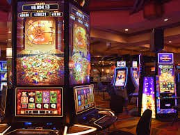 Filipino player spinning slot games on a mobile phone using nustagame